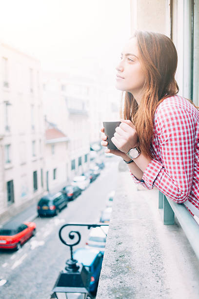 istock Profile of young woman drinking coffee 538352020