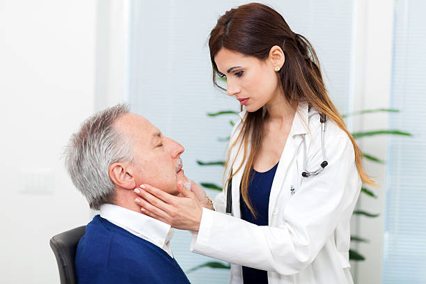 istock Doctor checking the lymph nodes size of her patient 538352534