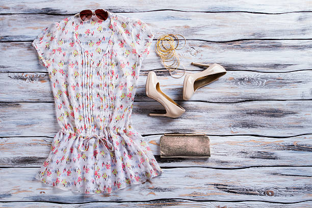 istock V-neck blouse and beige heels. 538352968