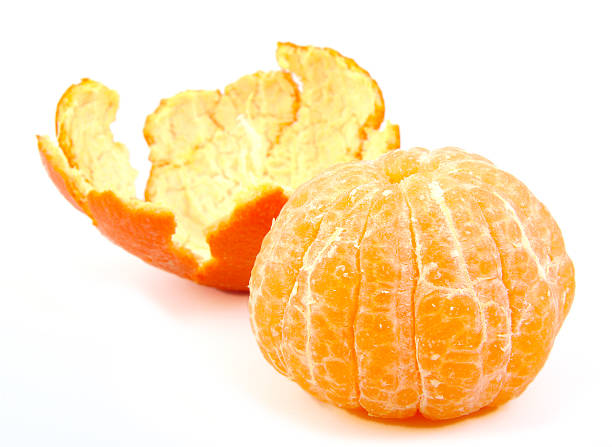 istock Single peeled tangerine or mandarin fruit with its skin on 538353757