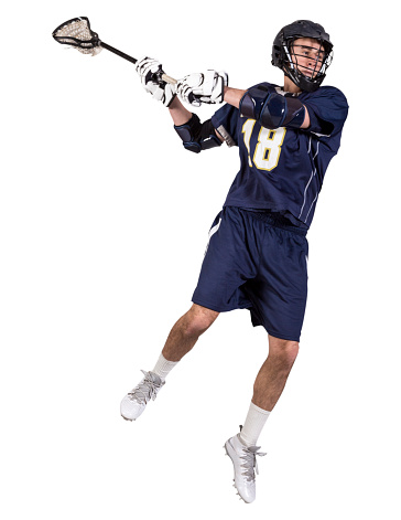 An action shot of a male lacrosse player taking a shot in mid air.