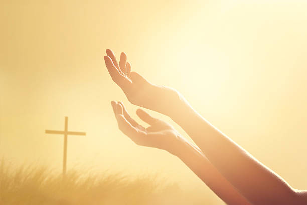 istock Respect and pray on the cross and nature sunset background 538354434