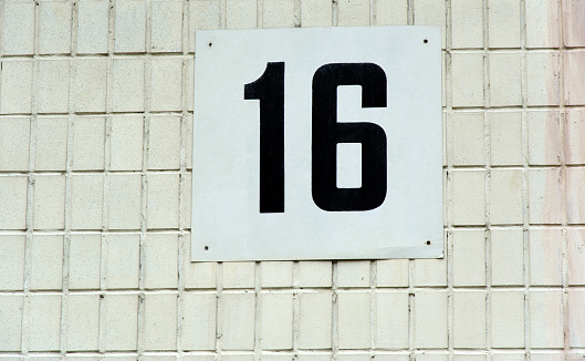 number sixteen on the rating plate on the wall