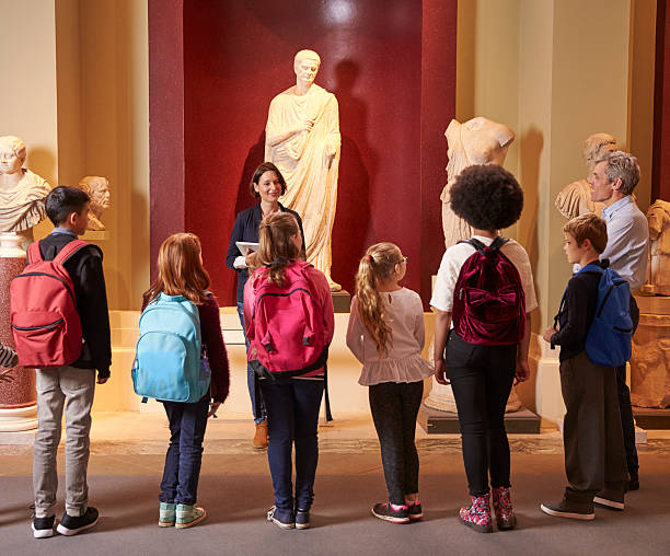 istock Pupils And Teacher On School Field Trip To Museum 538358254