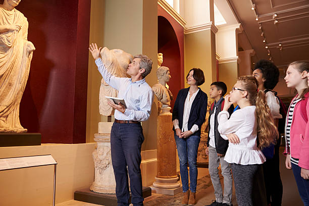 istock Pupils And Teacher On School Field Trip To Museum 538358308