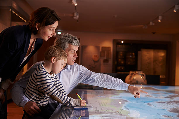istock Family On Trip To Museum Looking At Map Together 538358628