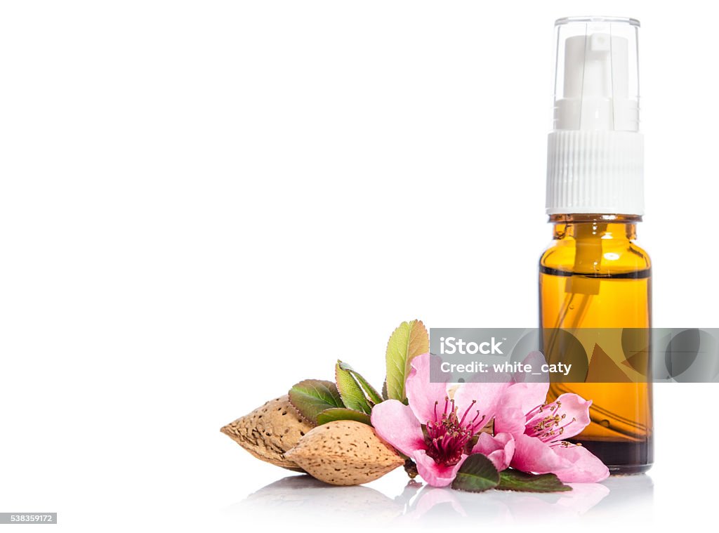 Face cream bottle whith flowers isolated on white Aging Process Stock Photo
