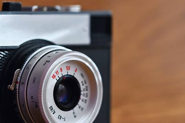 istock Russian old analog camera on a wooden background. 538359720