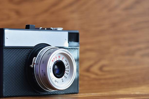 istock Russian old analog camera on a wooden background. 538359778