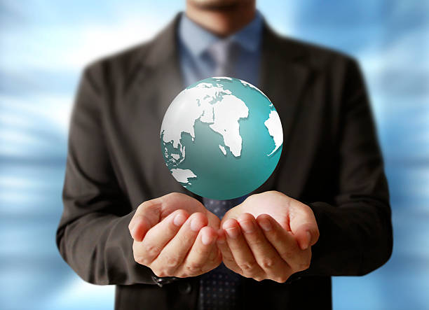 istock holding a glowing earth globe in his hands 538360031