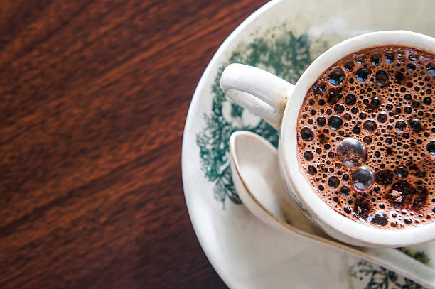 istock Cup of hot chocolate on wooden surface 538360035