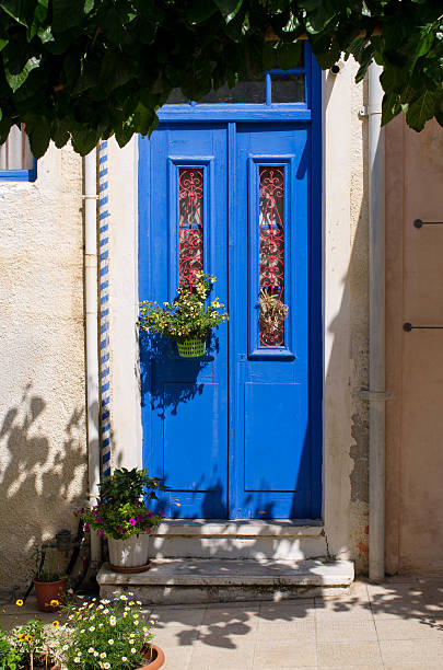 istock Blue door in natural plant frame 538361302