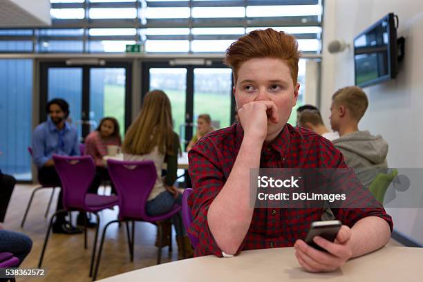 Stressed Student With Smartphone Stock Photo - Download Image Now - Teenager, Education, School Building