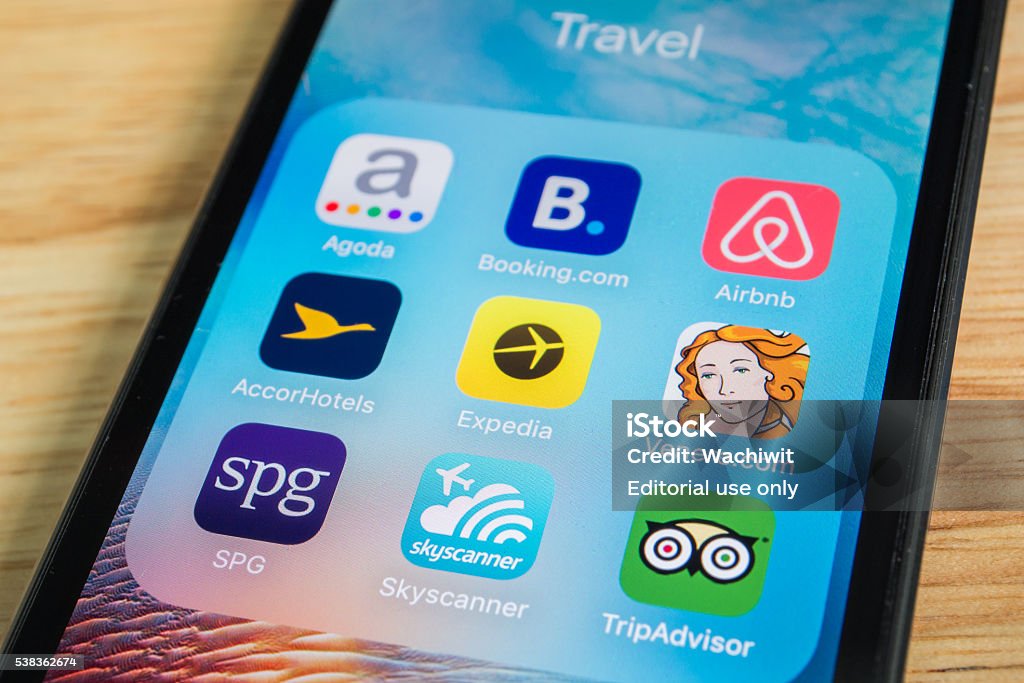 Travel Applications Bangkok, Thailand - June 6, 2016 : Apple iPhone5s showing its screen with popular travel applications. Airbnb Stock Photo