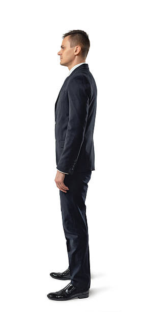 istock Side view of businessman standing, isolated on white background 538363526