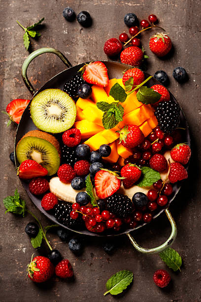 istock fresh fruits and berries on plate 538366492