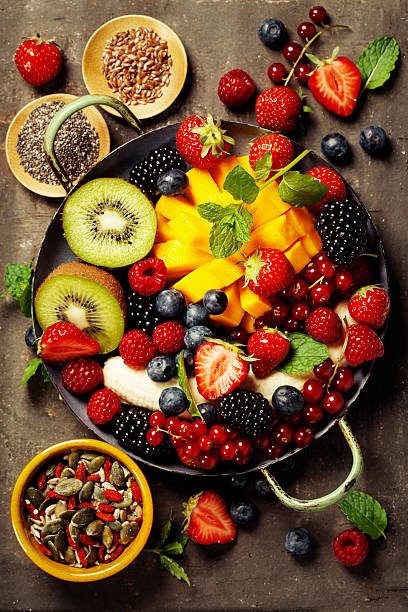 istock fresh fruits and berries on plate 538366630
