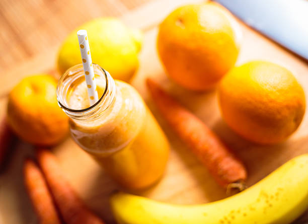 istock Orange, lemon banana and carrots smoothie 538367024