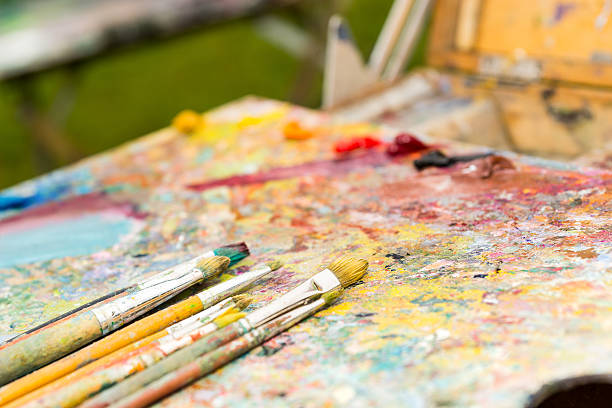 istock Closeup of different time-worn paintbrushes 538367722