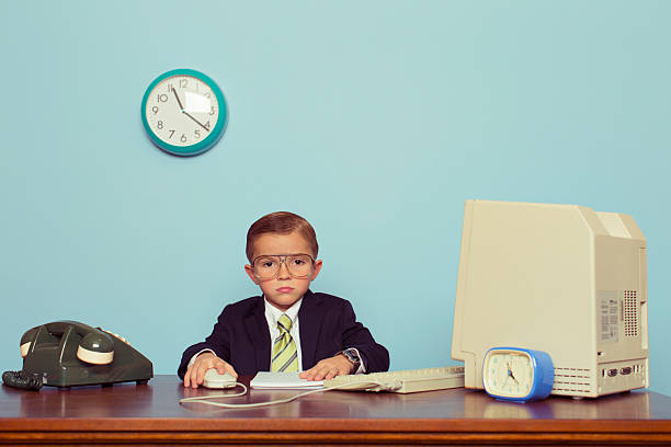 istock Young Boy Businessman Is Bored at the Office 538368187
