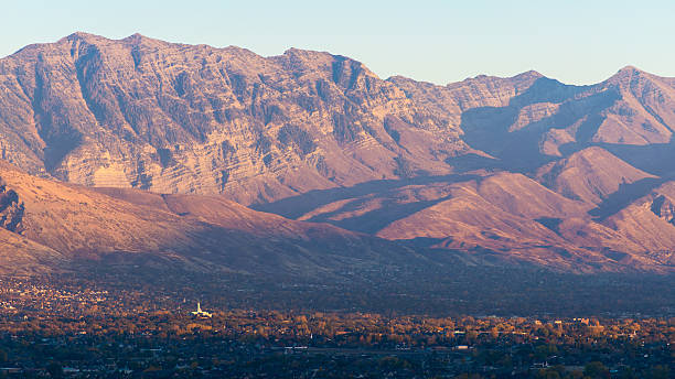 Utah Wasatch Mountains with Mount Timpanogos LDS Temple Utah Wasatch Mountains with Mount Timpanogos LDS Temple.  The peak on the left is Cascade Mountain.  The peak on the right is Provo Peak.  Image taken October 2014. provo stock pictures, royalty-free photos & images