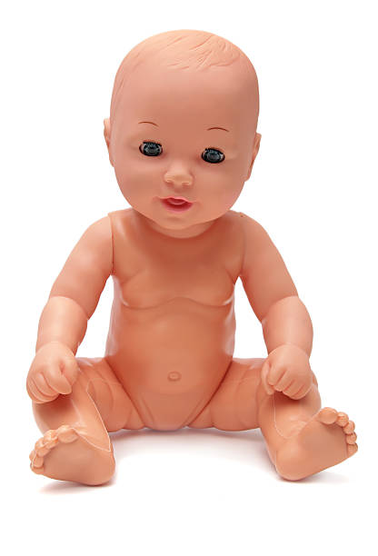 Plastic Baby Doll on Isolated White Background stock photo