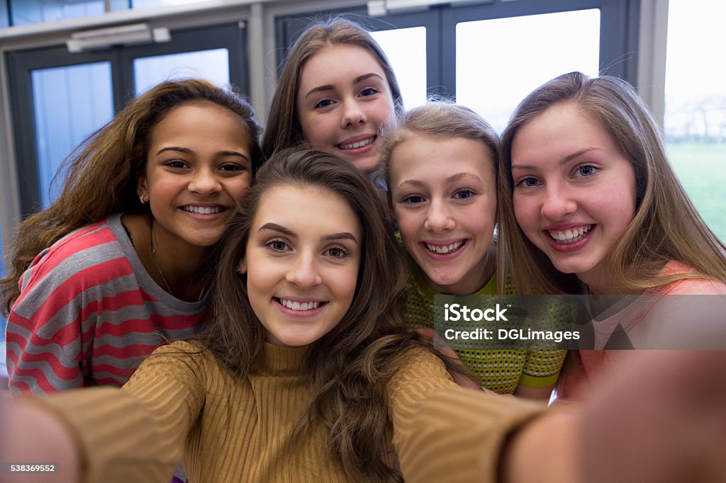 Selfie with the Girls Five teenage students taking a selfie in school. Teenagers Only Stock Photo