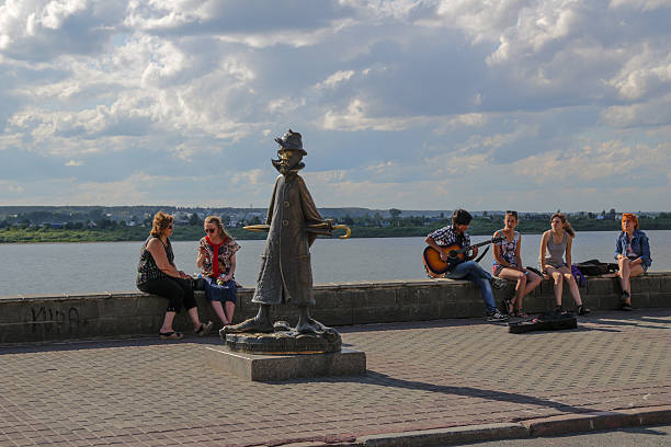 Tomsk, Russia - August 16, 2014: People are spending their times riversite of the Tomsk city, Siberia, Russia. Anton Chekhov in Tomsk through the eyes of a drunken man lying in a ditch and not read .The city is known for its gingerbread decorated architecture