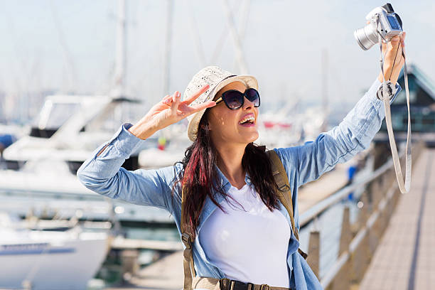 istock young female traveller taking selfie 538371837