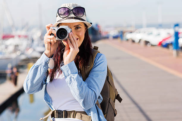istock tourist taking a photo 538373329