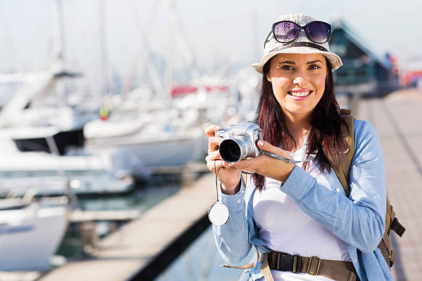 istock female tourist at the harbour 538373349