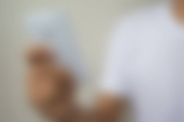 istock Close up of a man using mobile phone blur 538373651