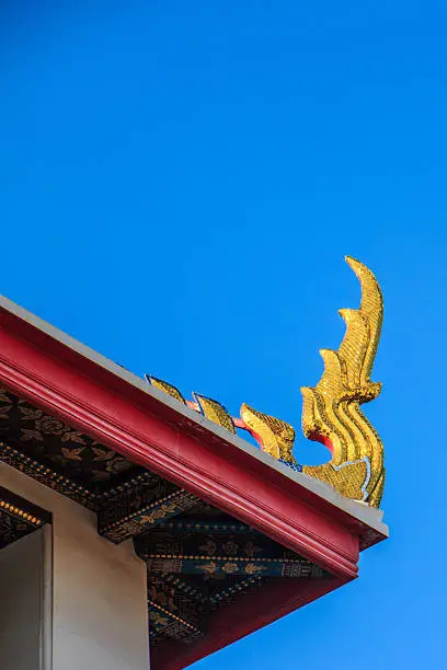 Golden stainglass on wat thai roof
