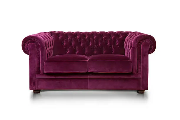 Purple luxurious sofa isolated on white background, front view.