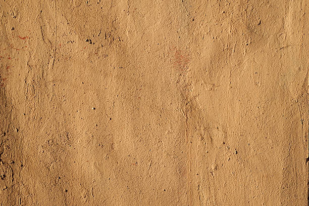 istock Texture of old wall covered with brown stucco 538393181