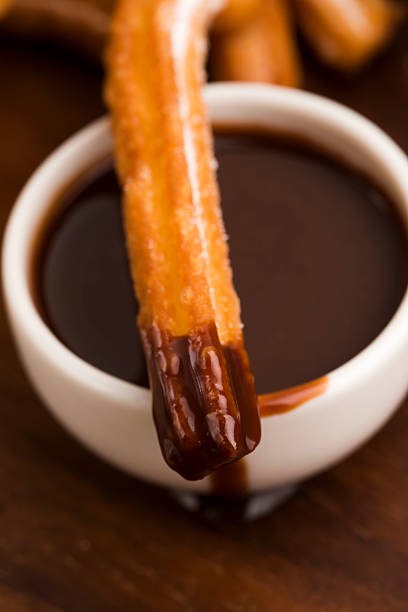istock deliciuos spanish Churros with hot chocolate 538393641