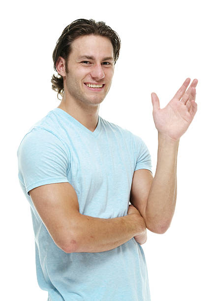 istock Smiling casual man waving hand 538395031