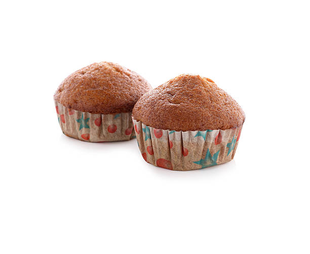 istock banana muffin cupcake on white background 538395289