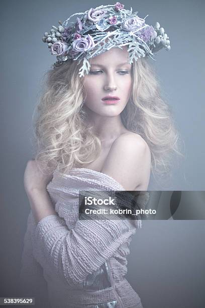 Girl With Flowers On Her Head In A Dress Stock Photo - Download Image Now - 2015, Adult, Adults Only