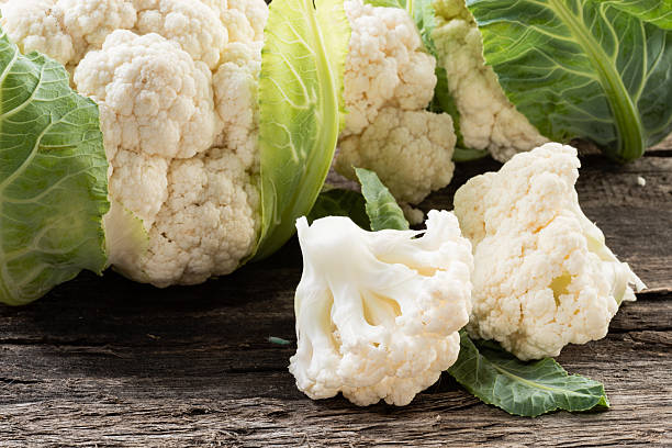 istock Organic cauliflower on wooden background 538396081