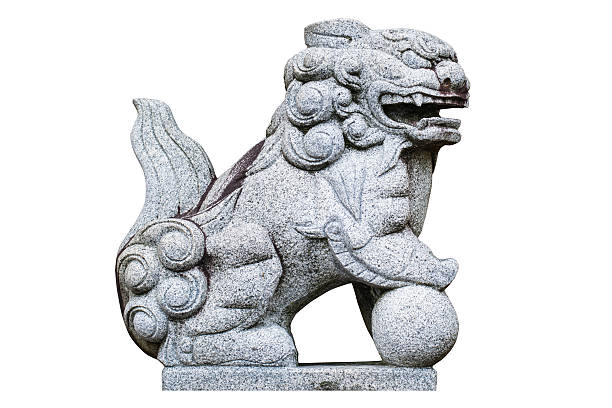 istock Chinese stone lion with globe isolated on white. 538404599