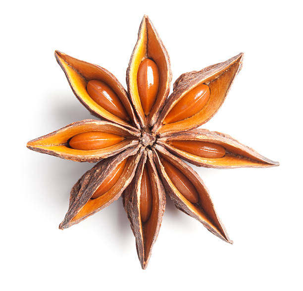 Anise star on white Close up of anise star on white background. This file is cleaned, retouched and contains clipping path. star anise stock pictures, royalty-free photos & images