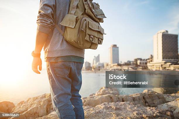 Traveler Standing On The Rocks Near The Sea Stock Photo - Download Image Now - Backpack, Sea, 2015