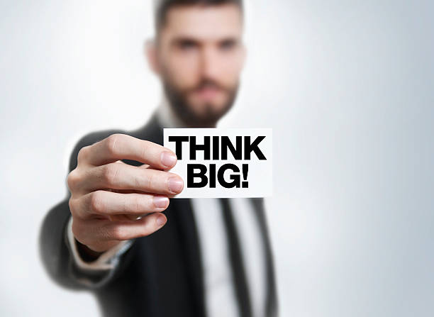 istock Businessman holding business card / think big! (Click for more) 538407793