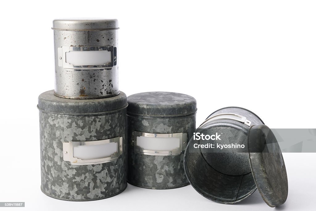 Isolated shot of old rusty tin can on white background Row of old four rusty tin can isolated on white background with two clipping path. (Tin can & Blank label)  2015 Stock Photo