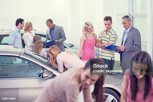 Large Group Of People At The Car Exhibition Stock Photo - Download Image Now - Car Dealership, Crowd of People, Customer