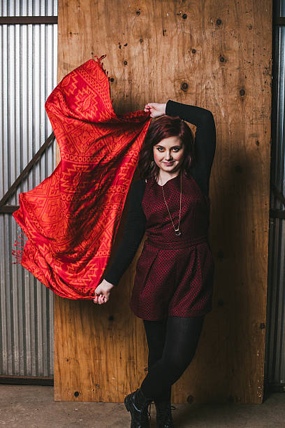 istock Beautiful unique young woman dancing with red scarf 538445565