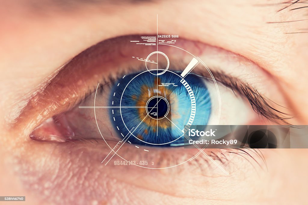 Security Retina Scanner on blue eye Stunning blue eye with an abstract Security Retina Scanner attached – great detail in the eye! Eye Stock Photo