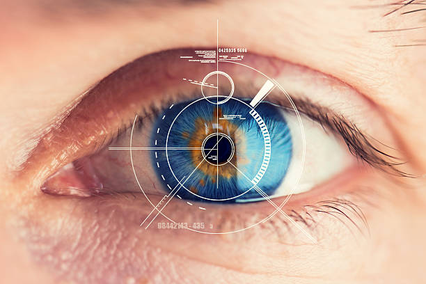 Security Retina Scanner on blue eye Stunning blue eye with an abstract Security Retina Scanner attached – great detail in the eye! iris eye stock pictures, royalty-free photos & images