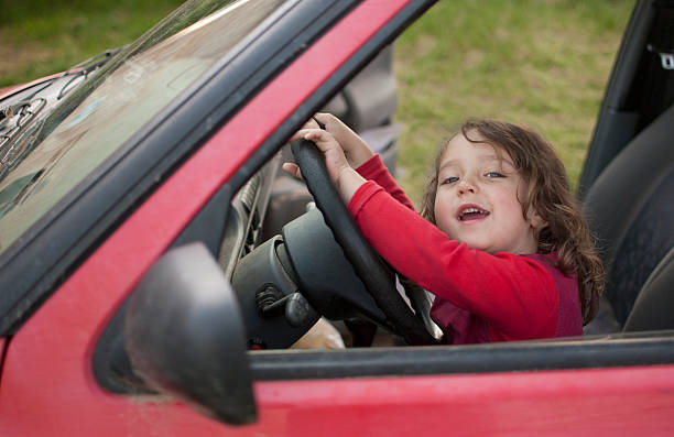 istock Smiling girl driving car 538446902